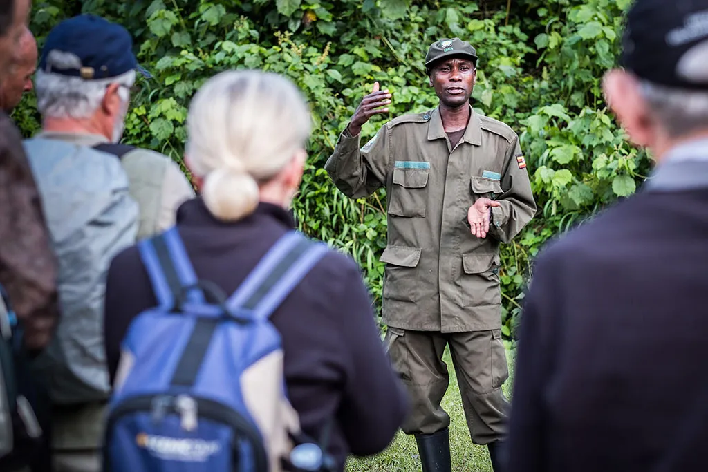 Uganda Wildlife Authority ranger briefing tourists before gorilla trekking in Uganda
