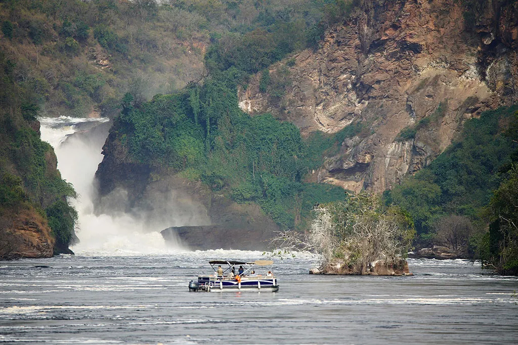 Boat cruise on the Nile River approaching Murchison Falls during a 12-days Uganda safari in Murchison Falls National Park