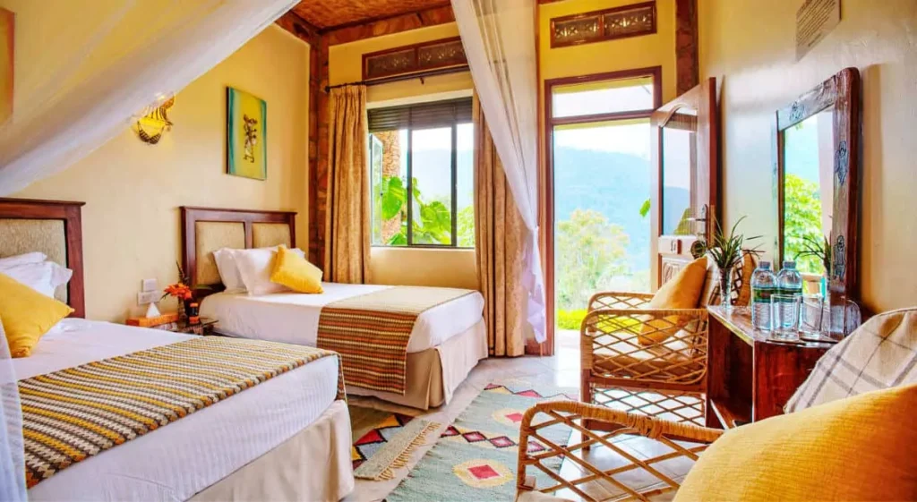 Comfortable twin room with scenic forest views representing upper mid-range accommodation near Bwindi Impenetrable National Park, Uganda